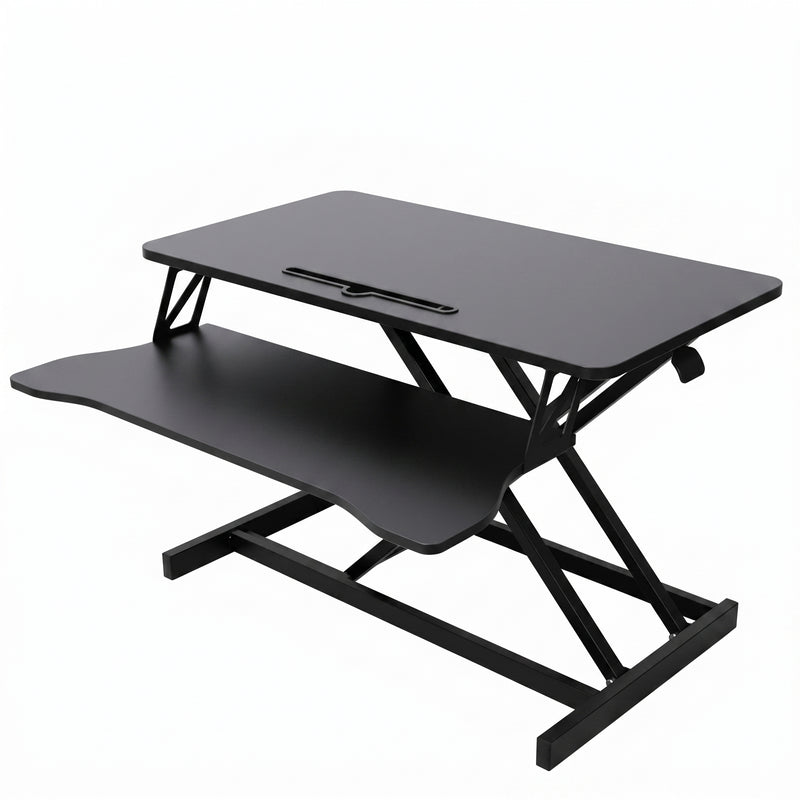 Black standing desk converter shown raised to standing height with keyboard tray