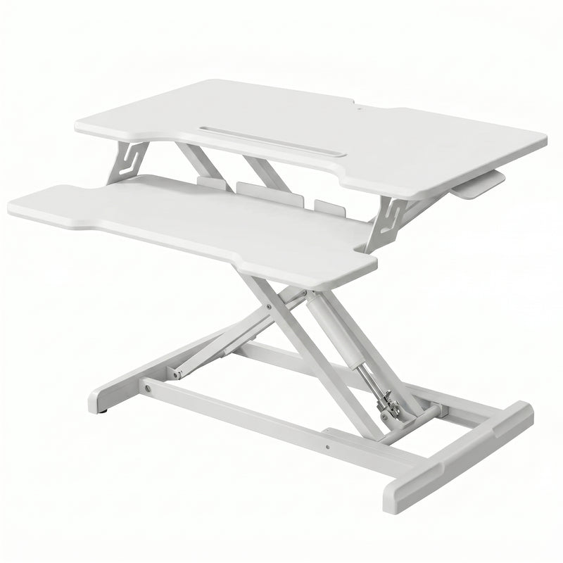 Black standing desk converter shown raised to standing height with keyboard tray