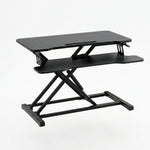Black standing desk converter shown raised to standing height with keyboard tray extended - 36" Black 2