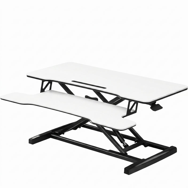 Black standing desk converter shown raised to standing height with keyboard tray
