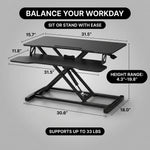Standing desk converter dimension diagram showing 30 lb desktop capacity and platform measurements