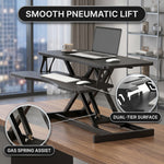 Standing desk converter keyboard tray capacity and pneumatic lift mechanism diagram