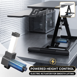 Woman taking notes at a raised standing desk converter in an open office