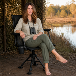 Hunter using camo swivel hunting chair with binoculars in a field