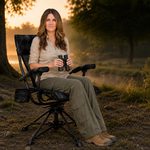 Hunter using camo swivel hunting chair with binoculars in a field