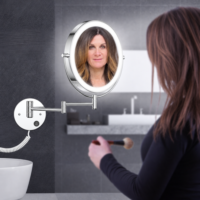 Woman applying makeup using a wall-mounted LED magnifying mirror at a bathroom vanity