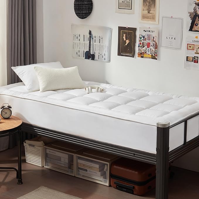 Quilted waterproof mattress protector on a bed in a bright bedroom
